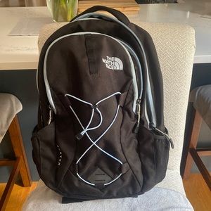 blue and black womans north face backpack
